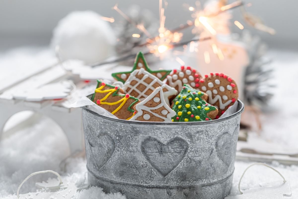 Christmas royal icing cookies packaged in a bucket.